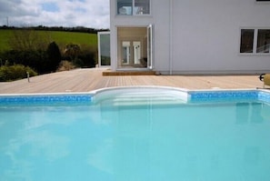 Open plan living straight into the Heated Pool.