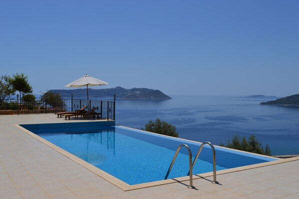 A 2m deep infinity pool with large terrace area.