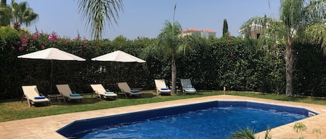 Comfortable sun loungers with thick cushions