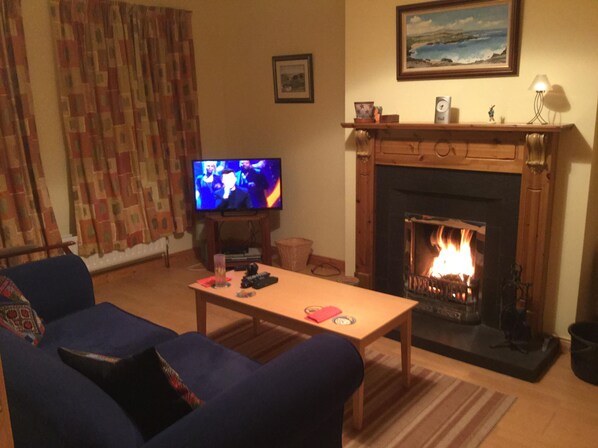 Separate lounge, open fire, flat screen TV with satellite channels