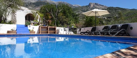 pool, villa and mountain backdrop