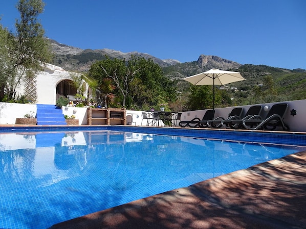 pool, villa and mountain backdrop