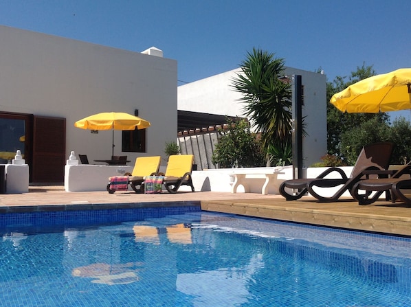 View of villa, garage and 5m x 9m solar heated , salt water pool 