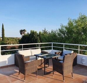Seating and dining area on the roof terrace with great views of the area around