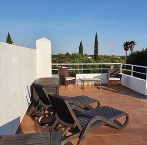 Seating and sunbathing on the roof terrace.