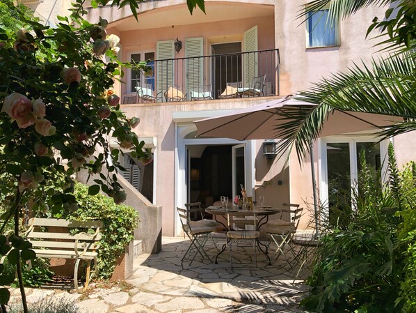 View from garden showing garden level rooms and upper terrace off main bedroom
