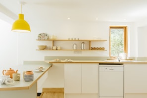 Well appointed kitchen area with kitchen sink facing a bird feeder to watch!