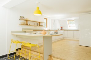 Light and airy kitchen with breakfast bar.  Very well equipped for dining.