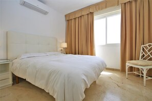 Master bedroom with king size bed and sea views