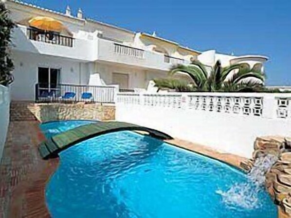 Swimming pool and front of cottage