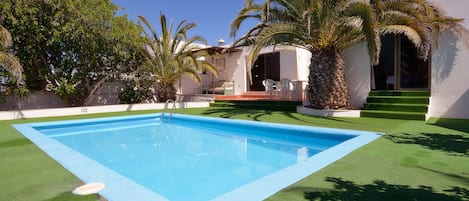 POOL WITH ASTROTURF SURROUNDING SWIMMING POOL