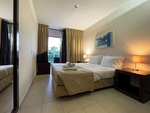  Bedroom suite, with double bed, wardrobe, bedside table, air conditioning and access to balcony 