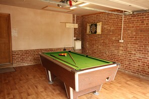 Pool table and darts in the garage aka games room 