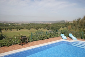 view over pool to golf course