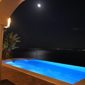 POOL, SEA & bay views at night.