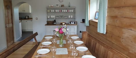 Dining room with a view into the kitchen