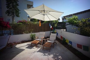 A range of quality, comfortable poolside sun loungers and parasols is provided.