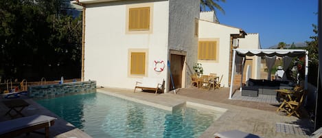 The newly completed private pool and sun terraces to the rear of the villa