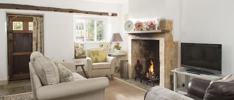 Sitting room with open log fire