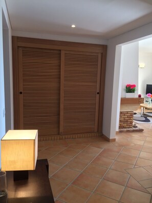 Spacious hallway leading to living room and balcony