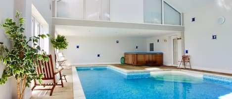 Private heated indoor swimming pool with hot tub