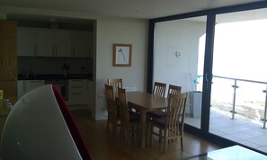 Dining table with egg chair in the foreground