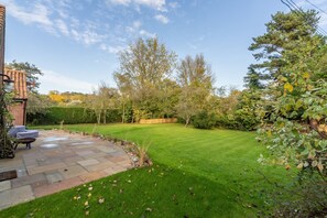 Waterside, Wiveton: Lawned garden with patio