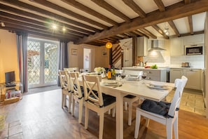 Toad Hall, Burnham Deepdale: Dining area with table and seating for eight guests
