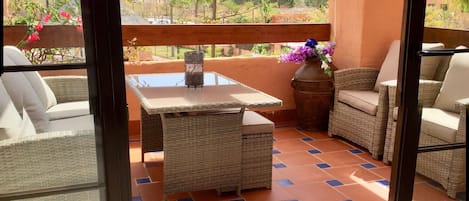 Terrace overlooking pool and tropical gardens a short walk to the beach