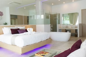 Calming, spacious modern en-suite bedrooms, with contemporary works of art
