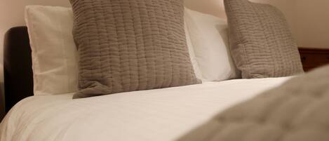 Comfortable double bed with luxurious crisp linen