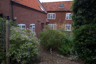 Spacious, attractive accommodation with south and west facing gardens 