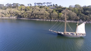 Tremerlin from Helford river showing quay, and main house