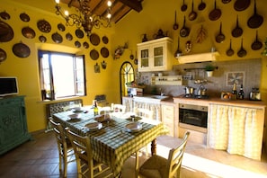 Stone kitchen with colecctions of authentic coopper cooking pots