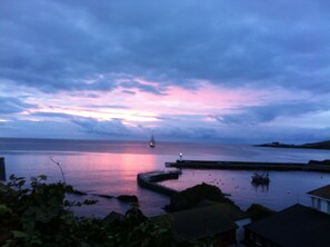 View from the cottage one morning - sunrise with a tallship from Charlestown