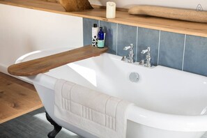 The roll-top bath in the master bedroom