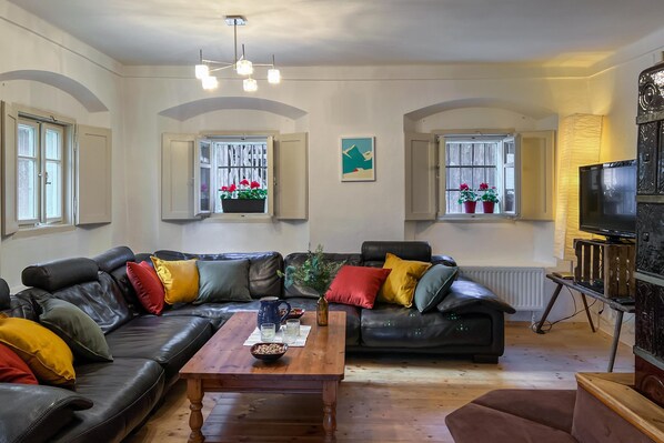 The cool living room comfortably seats six. 
A great place for your group to relax - chatting over drinks and nibbles, playing games or just watching a film. 