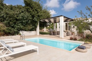 Sophisticated pool surroundings offering a sense of genuine tranquility.