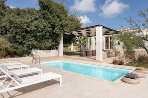 Sophisticated pool surroundings offering a sense of genuine tranquility.