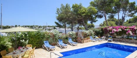 Private pool with comfortable sun loungers