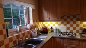 Fully fitted kitchen with hob, electric oven, dishwasher, freezer,  fridge