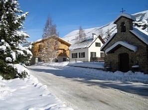 setting of wooden chalet in scenic old village