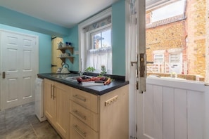 Ground floor: The kitchen has stable door leading to the garden