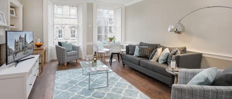 Sitting room and dining area - with views onto the Royal Mile and High Street