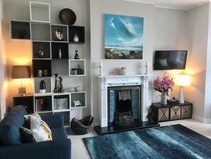 Fireplace and entertainement wall. Kindling and Peat Briquettes are provided