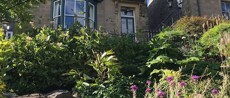 The house is set well back and high above West Road