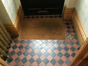 Original red and black tiles in the porch