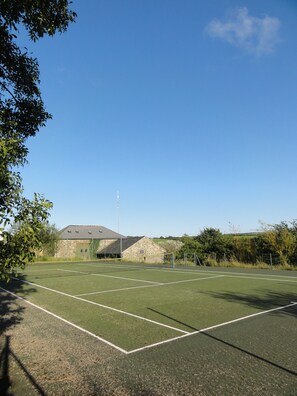 The tennis court is 30 paces away and is free. It's also great for kids just wanting to kick a ball about.