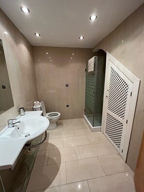 Family bathroom with shower.