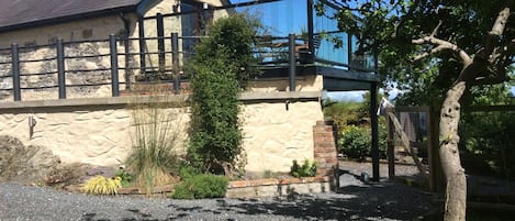 Balcony overlooking surrounding gardens and countryside 